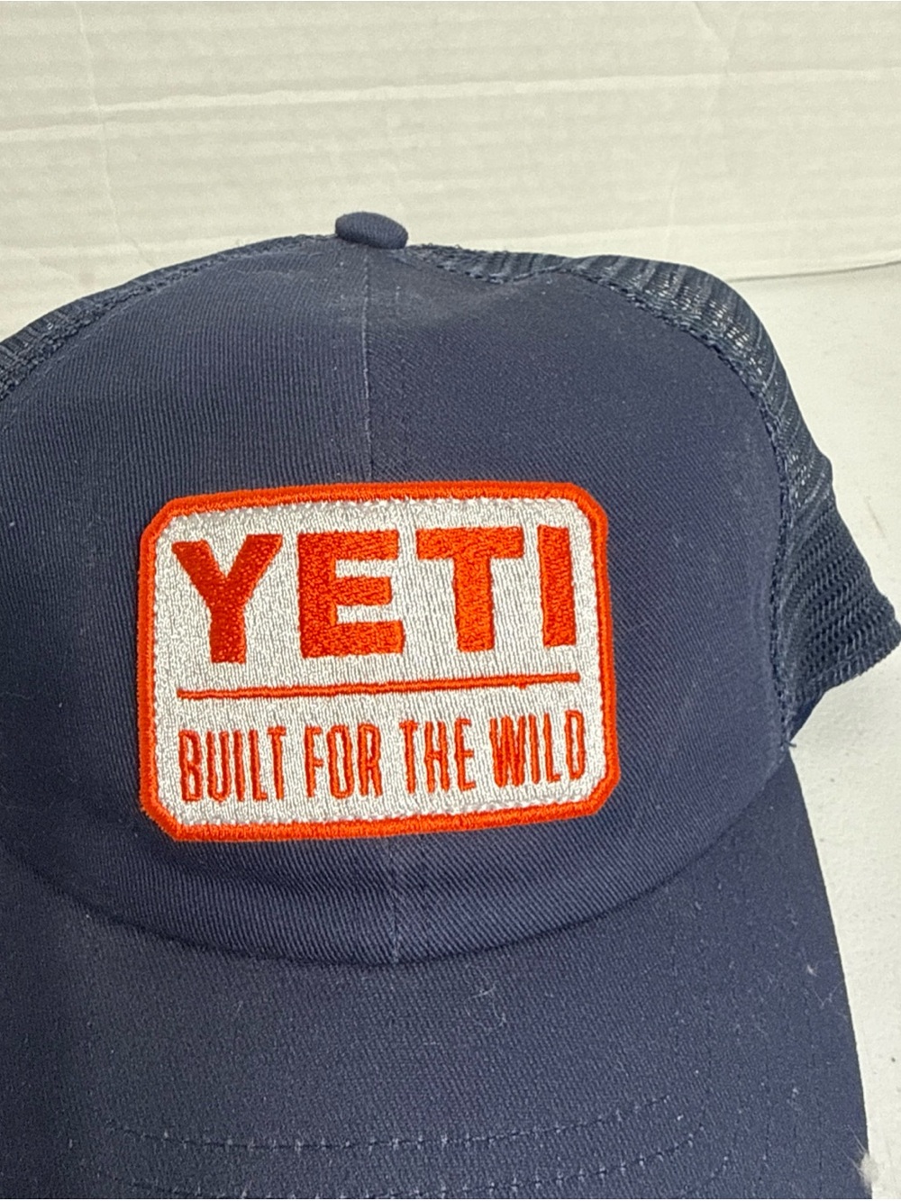 Yeti Navy Trucker Hat with Orange Logo
